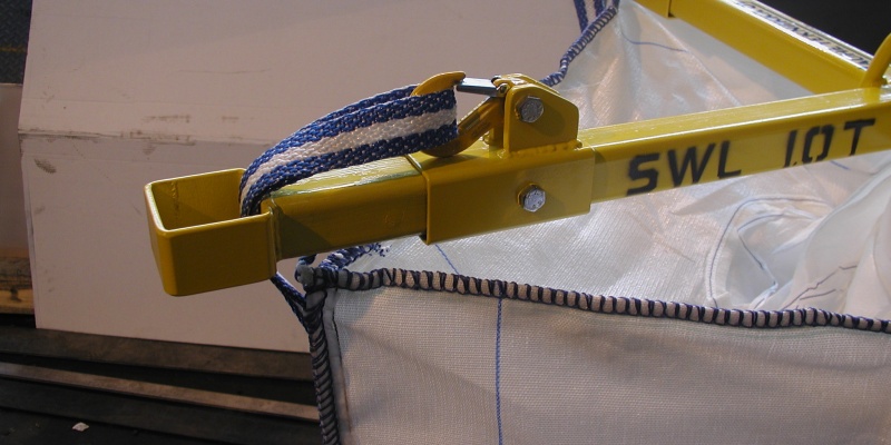 The lifting strap is attached to a hook with a safetly latch